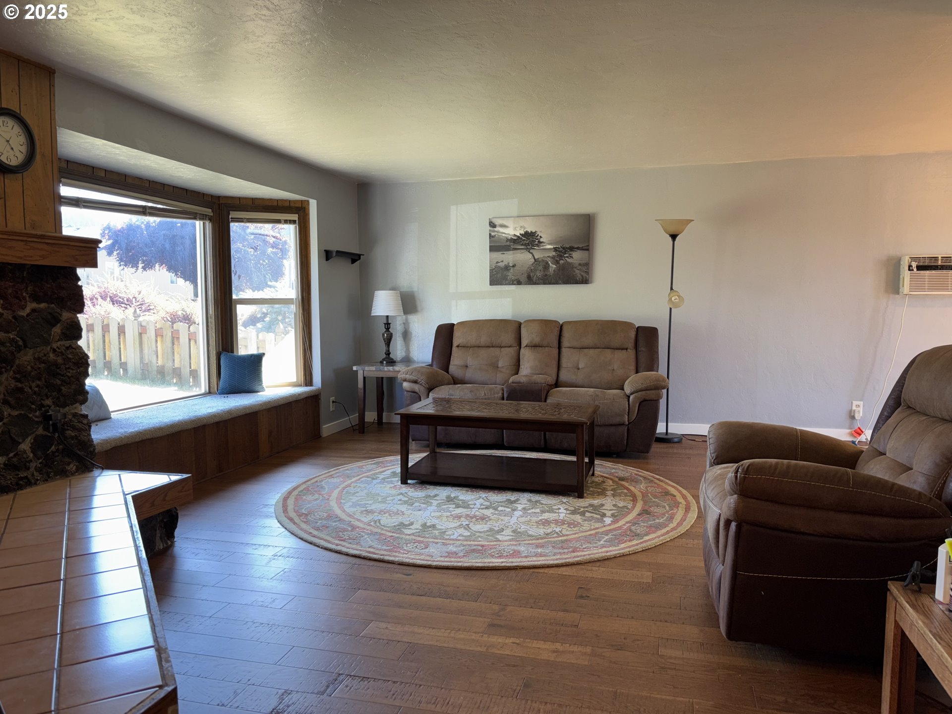 7066 Aster Street Springfield, OR 97478 - Photo 7 of 46 a living room with furniture and a fireplace