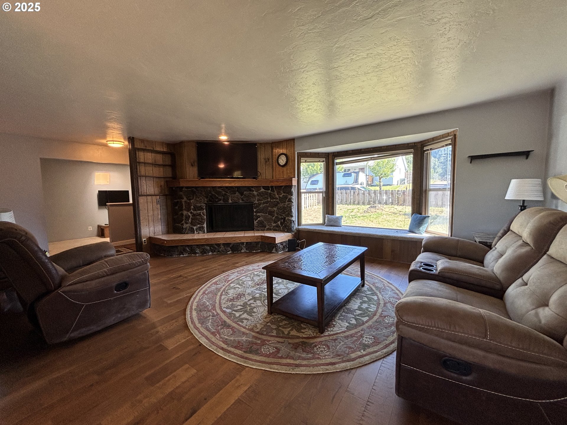 7066 Aster Street Springfield, OR 97478 - Photo 8 of 46 a living room with furniture and a fireplace