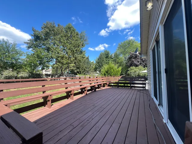a view of deck with patio and wooden floor