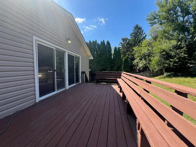 a view of deck with wooden floor and outdoor seating