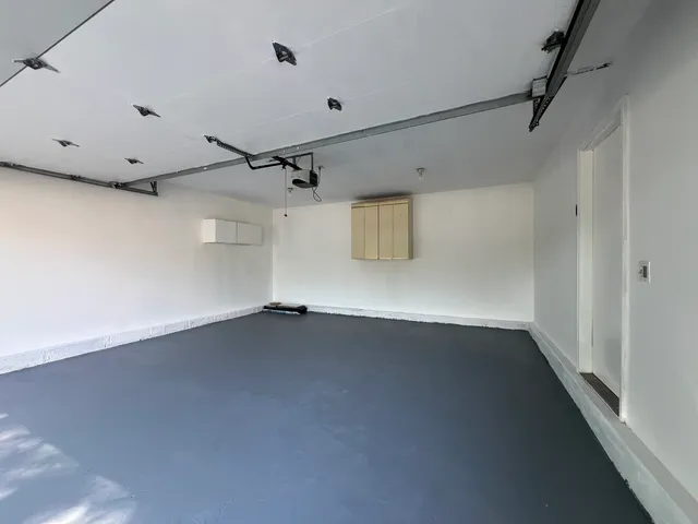 an empty room with a empty space and windows
