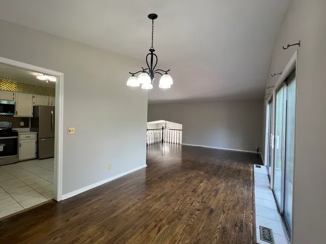 a view of livingroom and kitchen with hardwood floor