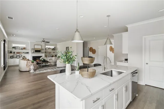 a kitchen with sink and refrigerator