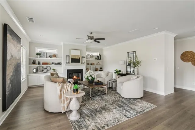 a living room with furniture a fireplace and a table