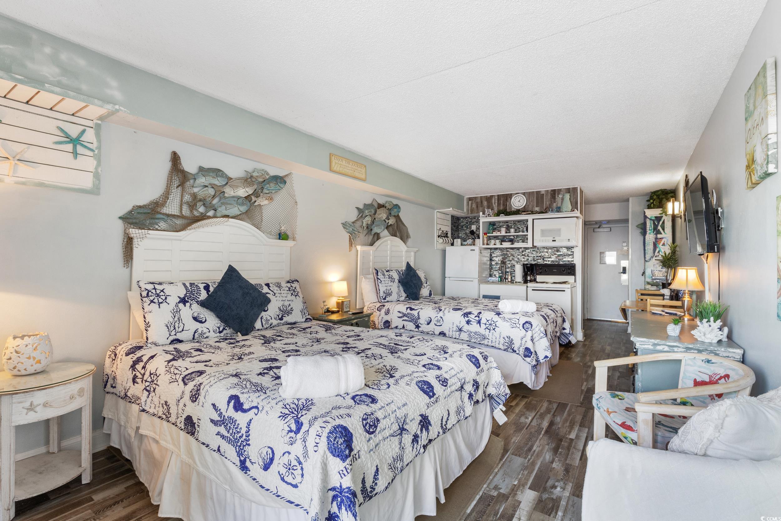 1207 South Ocean Boulevard, Unit 20603 Myrtle Beach, SC 29577 - Photo 9 of 19 Bedroom with dark wood finished floors