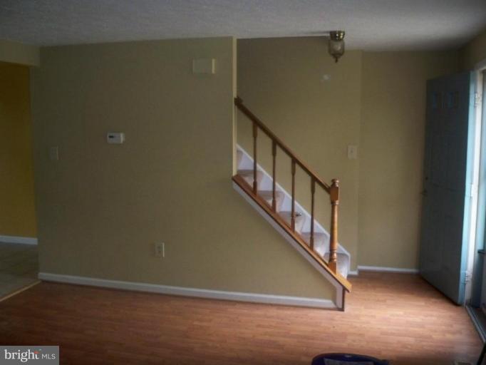 10501 Apple Ridge Road Gaithersburg, MD 20886 - Photo 12 of 15 a view of a hallway with staircase