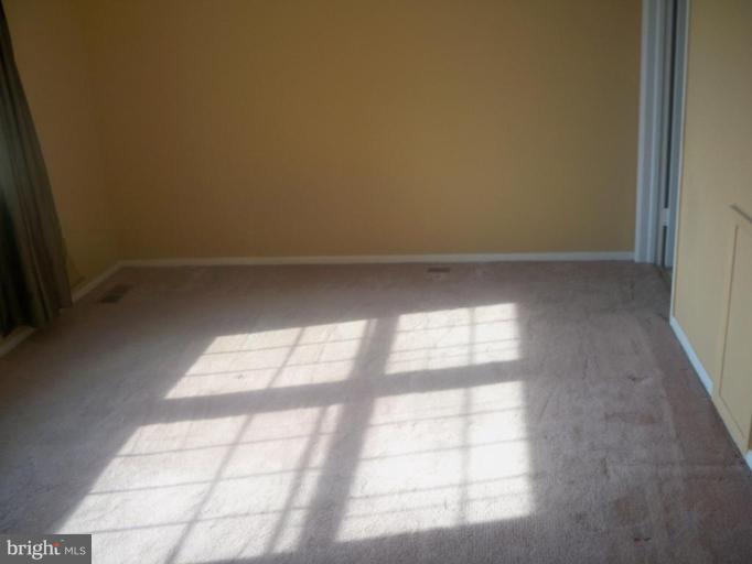 10501 Apple Ridge Road Gaithersburg, MD 20886 - Photo 7 of 15 a view of an empty room and window