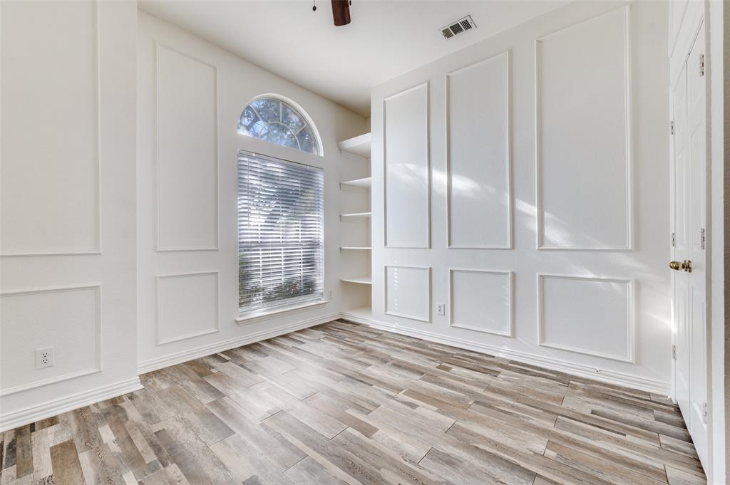 9611 Cliffside Drive Irving, TX 75063 - Photo 18 of 24 a view of empty room with wooden floor and fan