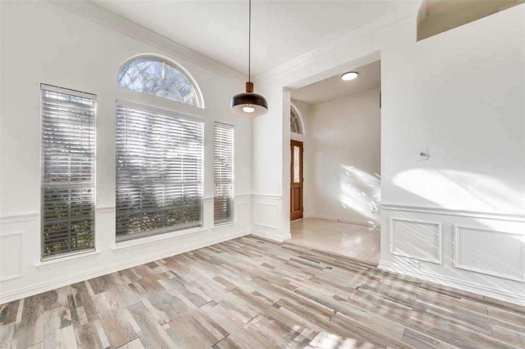 9611 Cliffside Drive Irving, TX 75063 - Photo 5 of 24 a view of empty room with wooden floor and fan