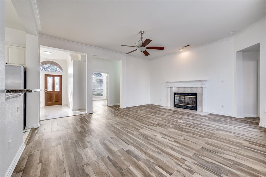 9611 Cliffside Drive Irving, TX 75063 - Photo 9 of 24 wooden floor in an empty room with a fireplace