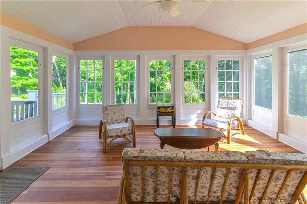 12 West Mountain Road Sharon, CT 06069 - Photo 16 of 33 a dining room with wooden floor and a floor to ceiling window