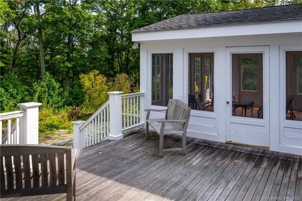 12 West Mountain Road Sharon, CT 06069 - Photo 17 of 33 a view of a patio with table and chairs and wooden floor