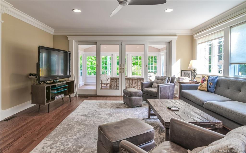 12 West Mountain Road Sharon, CT 06069 - Photo 18 of 33 a living room with furniture a flat screen tv and a large window