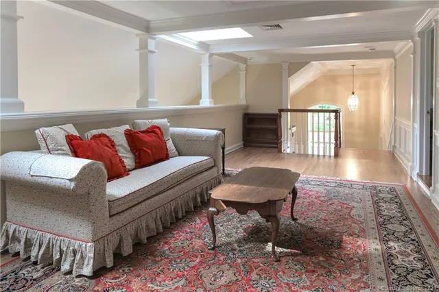 a living room with furniture and a rug