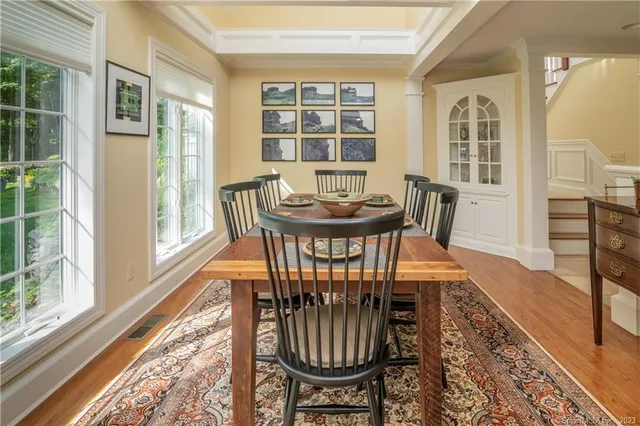 a view of a dining room with furniture window and wooden floor