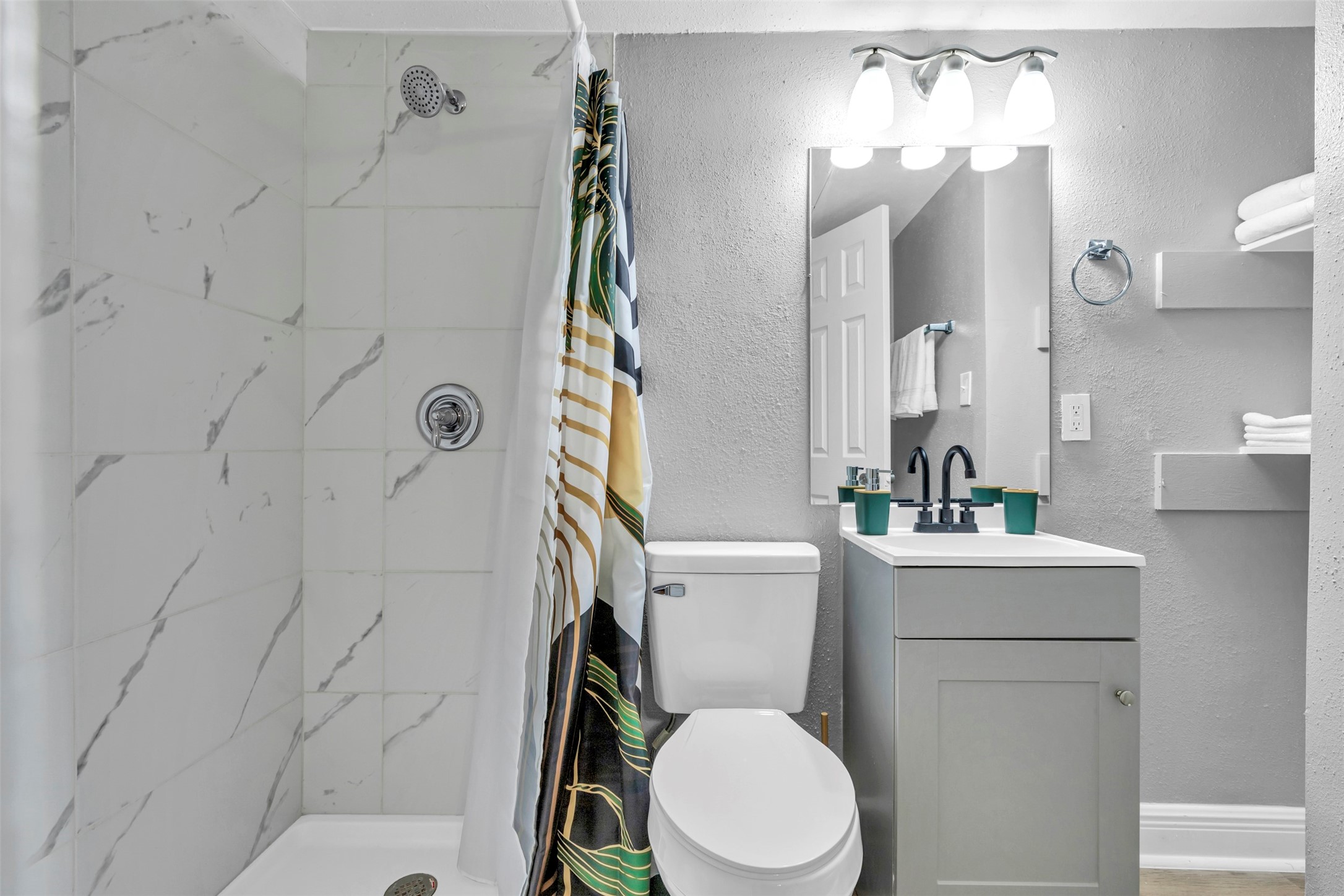 1840 Richmond Avenue, Unit 32 Houston, TX 77098 - Photo 11 of 19 a white toilet sitting next to a bathroom sink