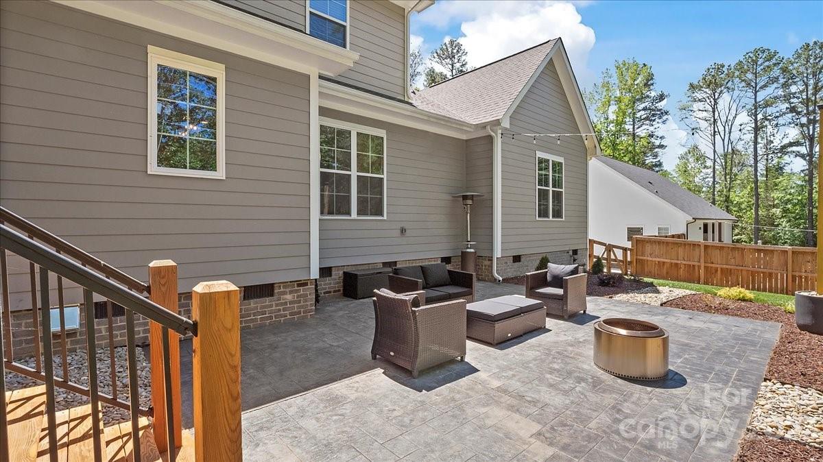 10154 Jim Sossoman Road Midland, NC 28107 - Photo 12 of 44 a view of a patio with couches and potted plants