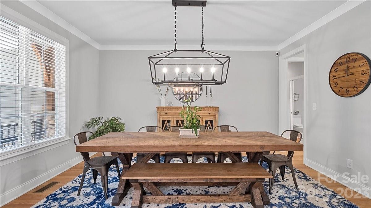 10154 Jim Sossoman Road Midland, NC 28107 - Photo 18 of 44 a view of a dining room with furniture window and wooden floor