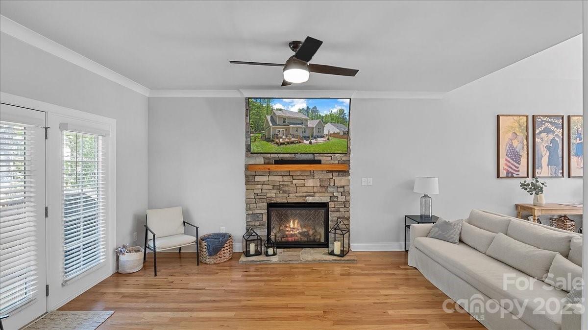 10154 Jim Sossoman Road Midland, NC 28107 - Photo 21 of 44 a living room with furniture and a fireplace
