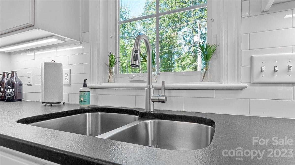 10154 Jim Sossoman Road Midland, NC 28107 - Photo 28 of 44 a kitchen with a sink and a window