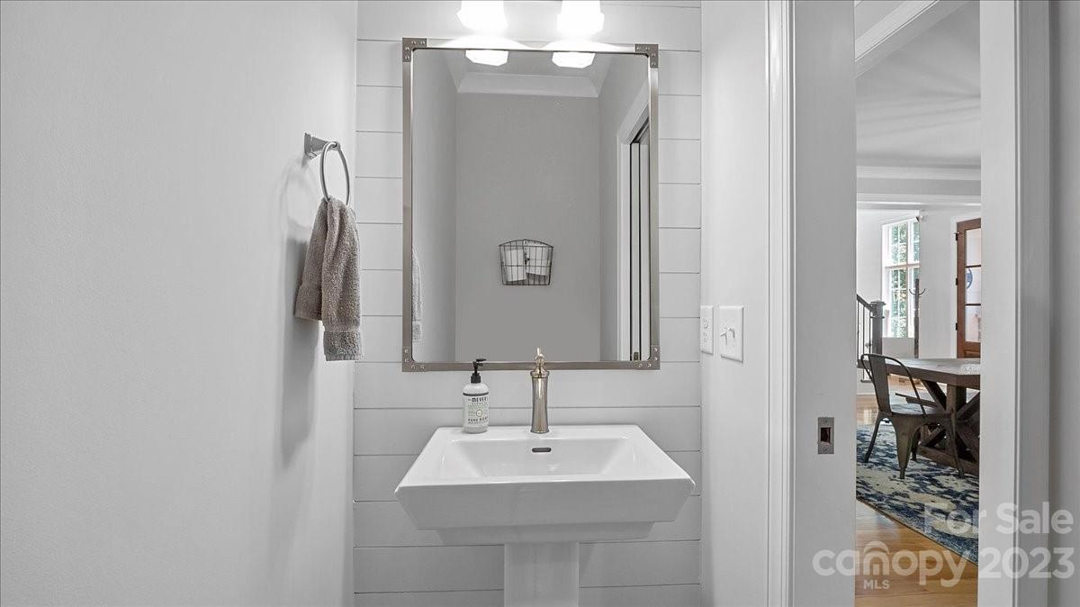 10154 Jim Sossoman Road Midland, NC 28107 - Photo 30 of 44 a bathroom with a sink and a mirror