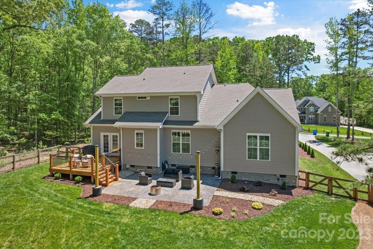 10154 Jim Sossoman Road Midland, NC 28107 - Photo 3 of 44 an aerial view of a house with swimming pool and garden