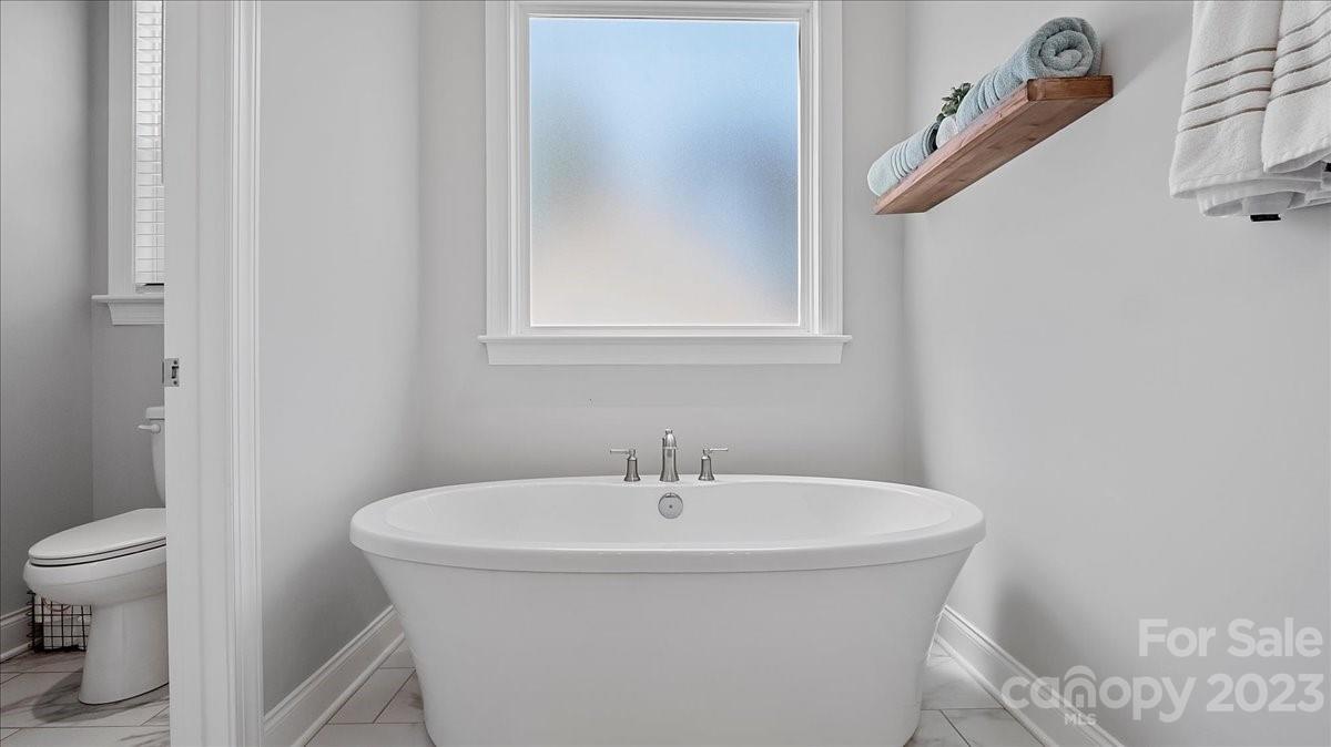 10154 Jim Sossoman Road Midland, NC 28107 - Photo 35 of 44 a bathroom with a sink and a toilet