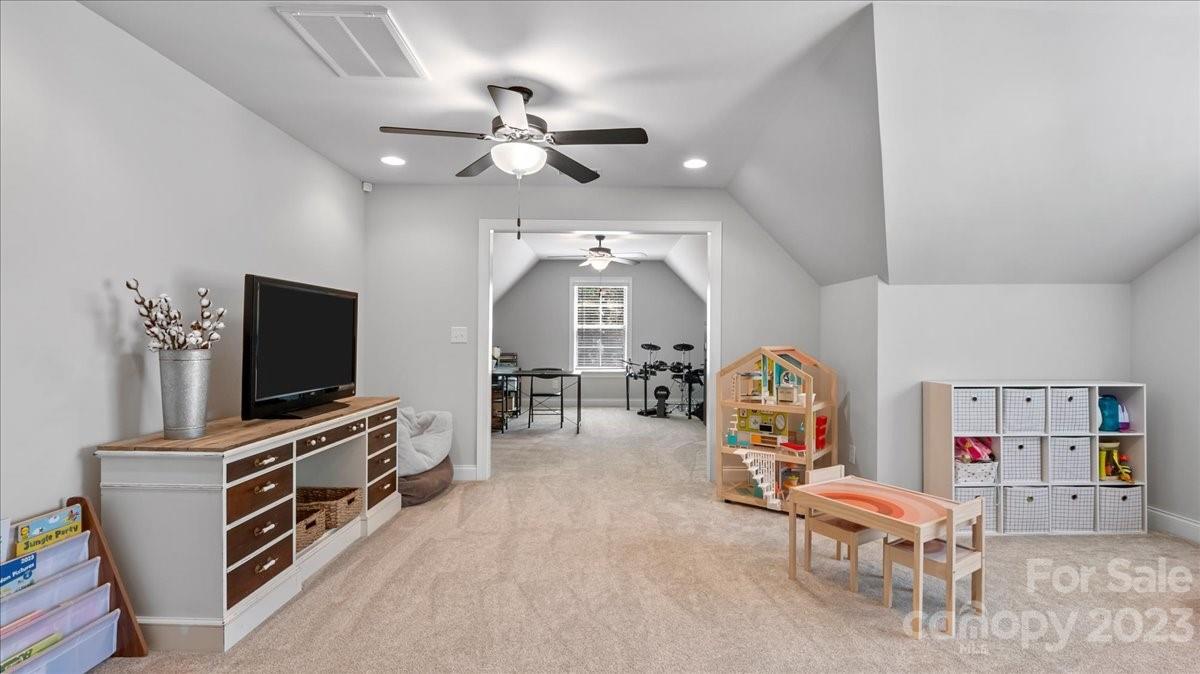 10154 Jim Sossoman Road Midland, NC 28107 - Photo 39 of 44 a living room with furniture and a flat screen tv