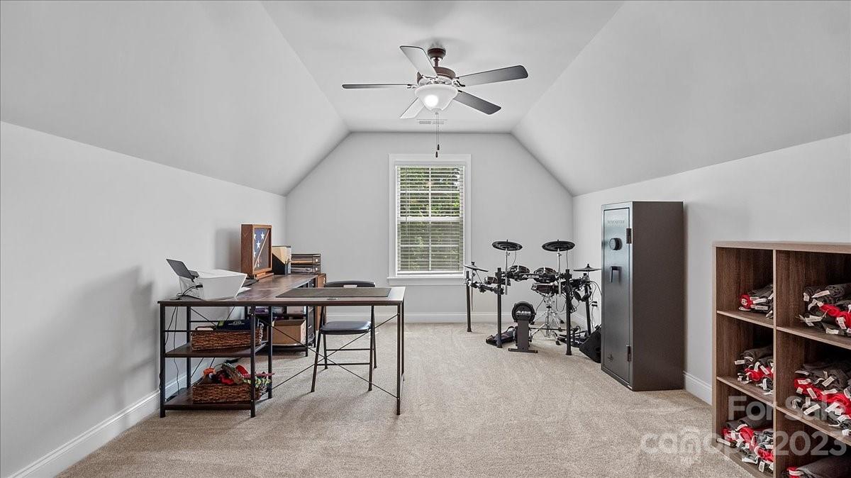 10154 Jim Sossoman Road Midland, NC 28107 - Photo 40 of 44 a view of a workspace with furniture and a window
