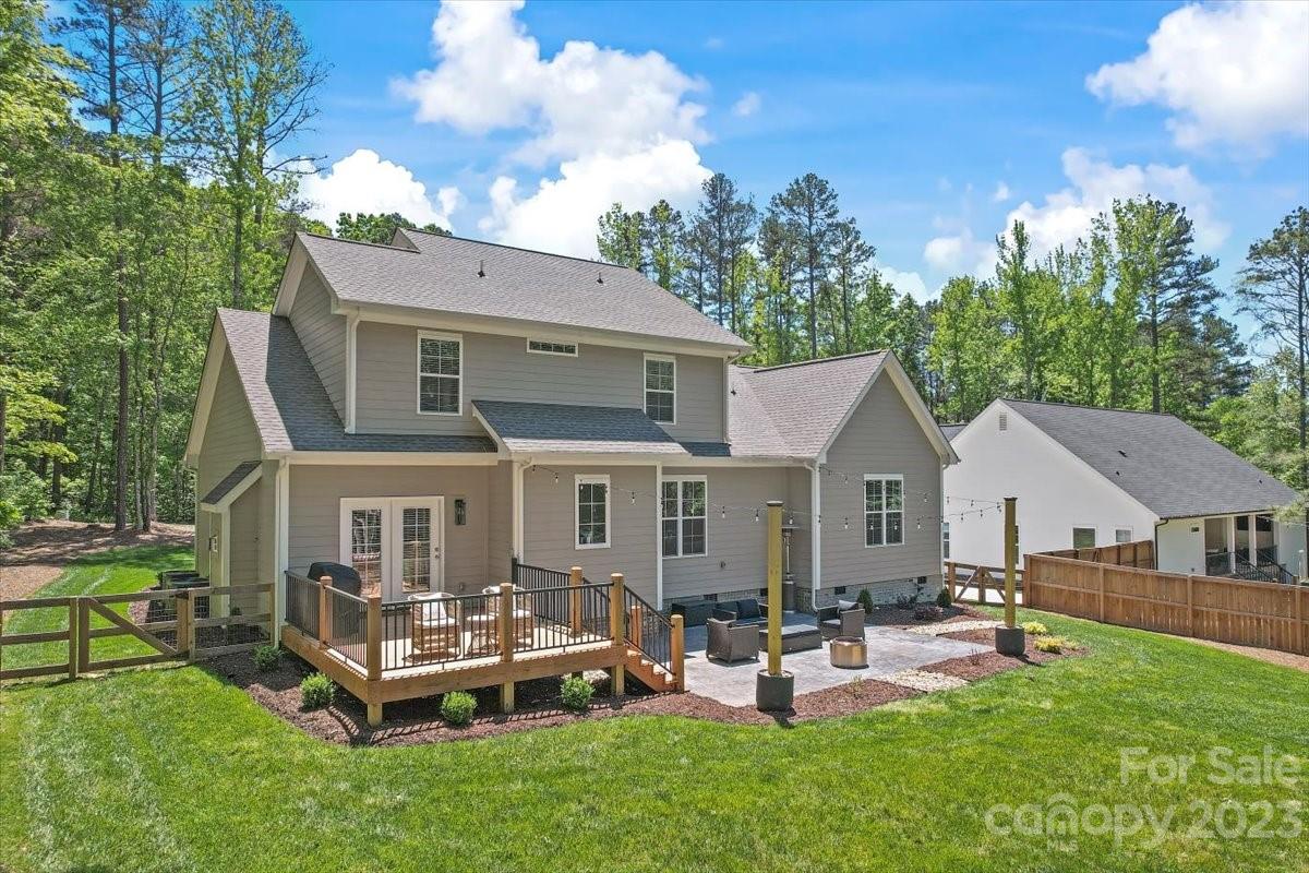 10154 Jim Sossoman Road Midland, NC 28107 - Photo 4 of 44 a front view of a house with garden and trees