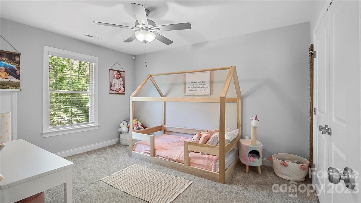 10154 Jim Sossoman Road Midland, NC 28107 - Photo 43 of 44 a bedroom with a bed and a window