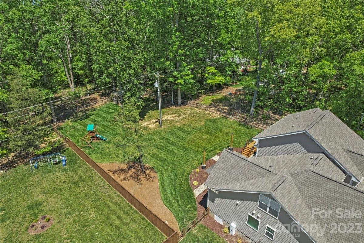 10154 Jim Sossoman Road Midland, NC 28107 - Photo 7 of 44 a view of a backyard with plants