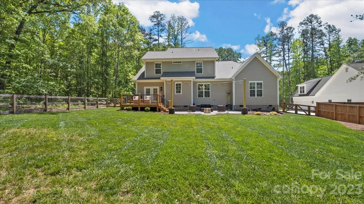 10154 Jim Sossoman Road Midland, NC 28107 - Photo 8 of 44 a front view of a house with a yard and trees