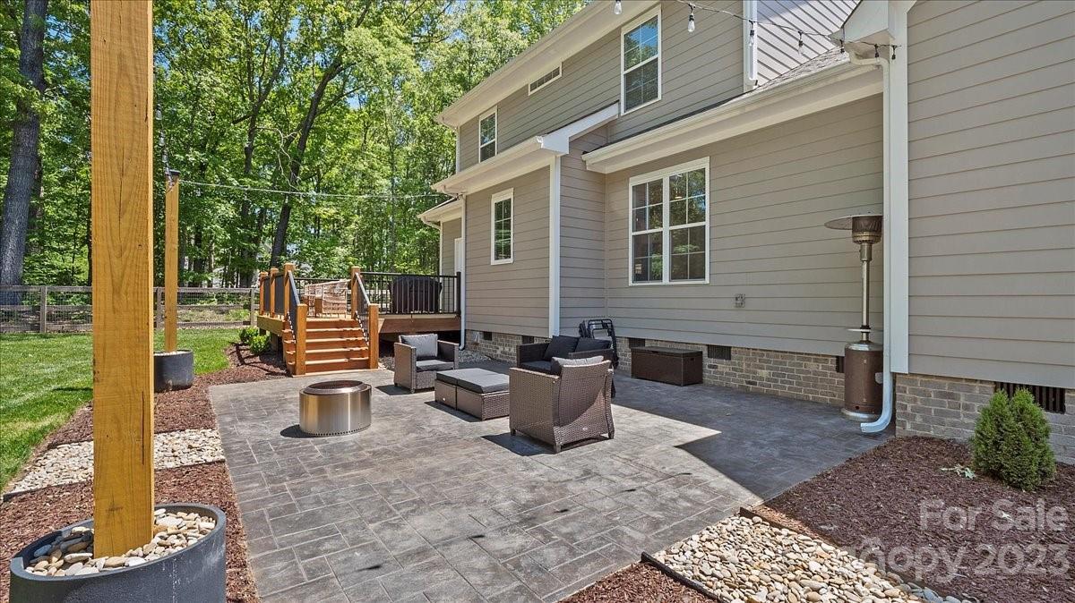 10154 Jim Sossoman Road Midland, NC 28107 - Photo 9 of 44 a view of a patio with chairs and plants