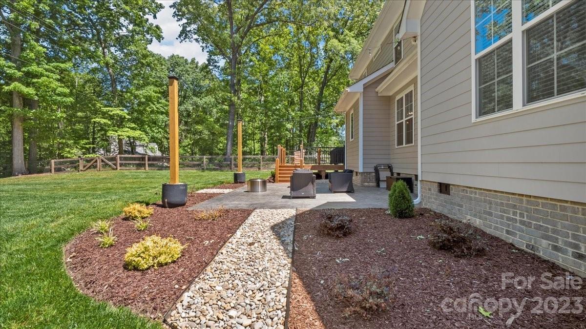 10154 Jim Sossoman Road Midland, NC 28107 - Photo 10 of 44 a view of a backyard with sitting area