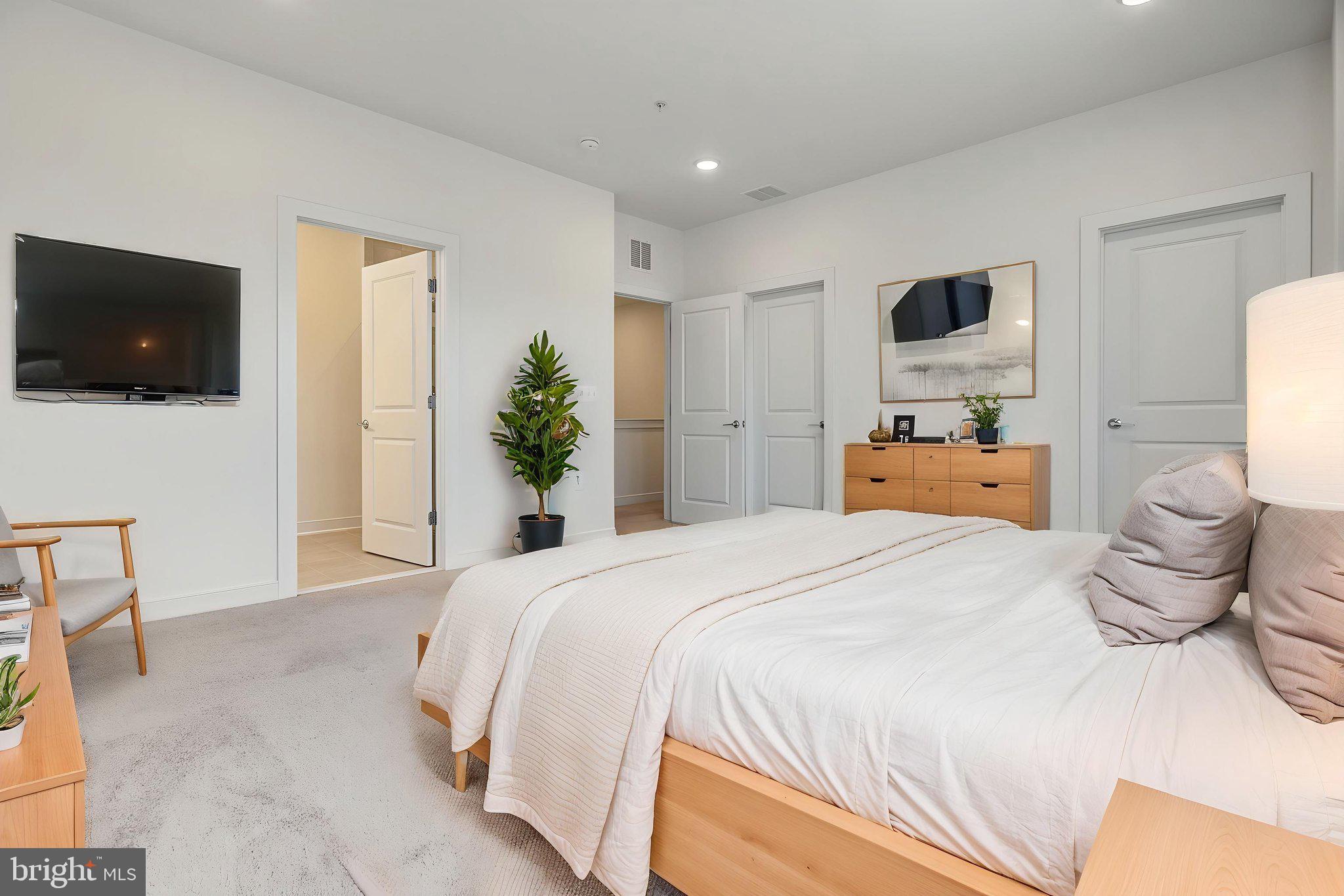 16122 Frederick Road, Unit 34 Rockville, MD 20855 - Photo 67 of 68 Virtually staged primary bedroom