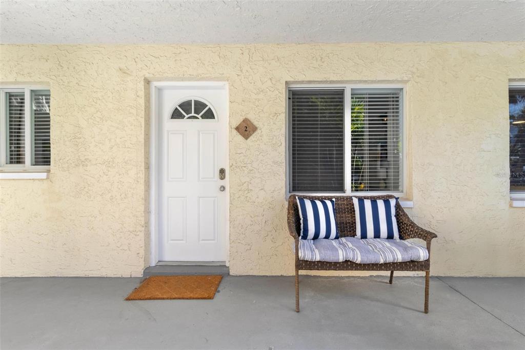2704 2nd Street, Unit 2 Indian Rocks Beach, FL 33785 - Photo 2 of 32 a bedroom with a bed and a window