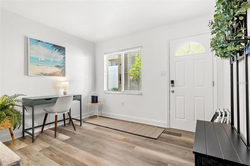 2704 2nd Street, Unit 2 Indian Rocks Beach, FL 33785 - Photo 3 of 32 a workspace with furniture and window