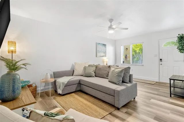 a living room with furniture and a large window