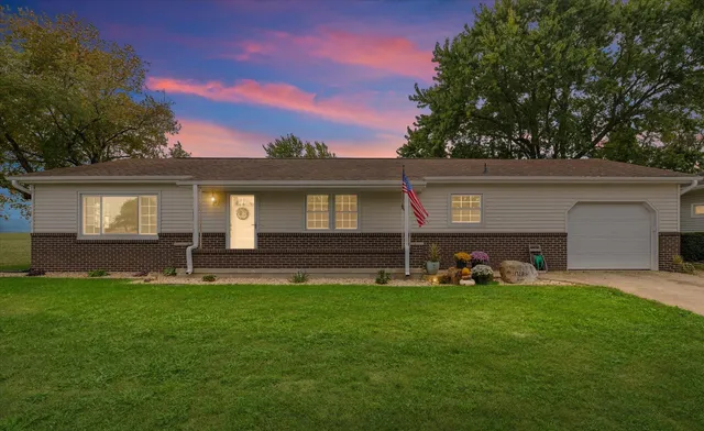 a backyard of a house with garden and barbeque oven