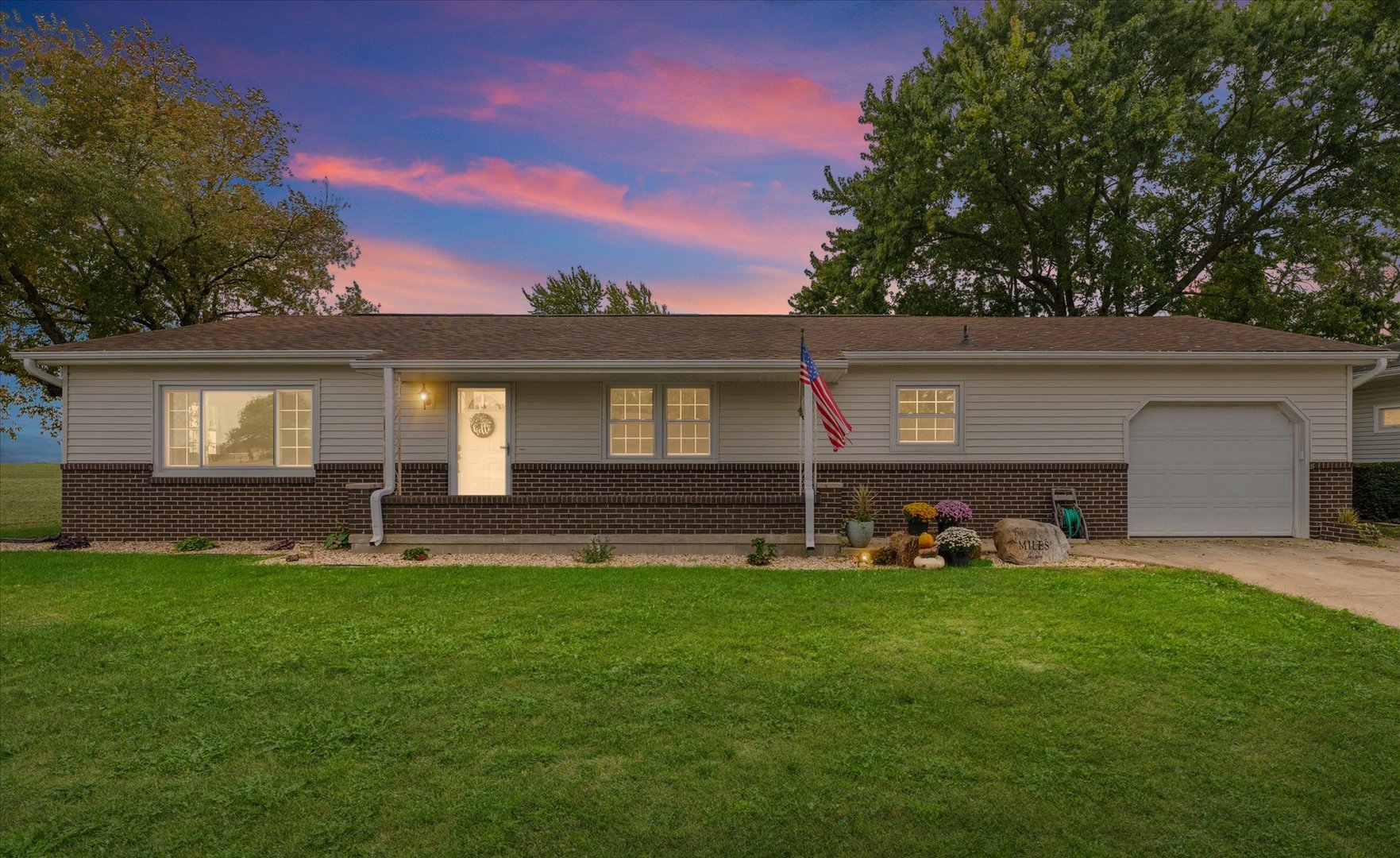 a backyard of a house with garden and barbeque oven