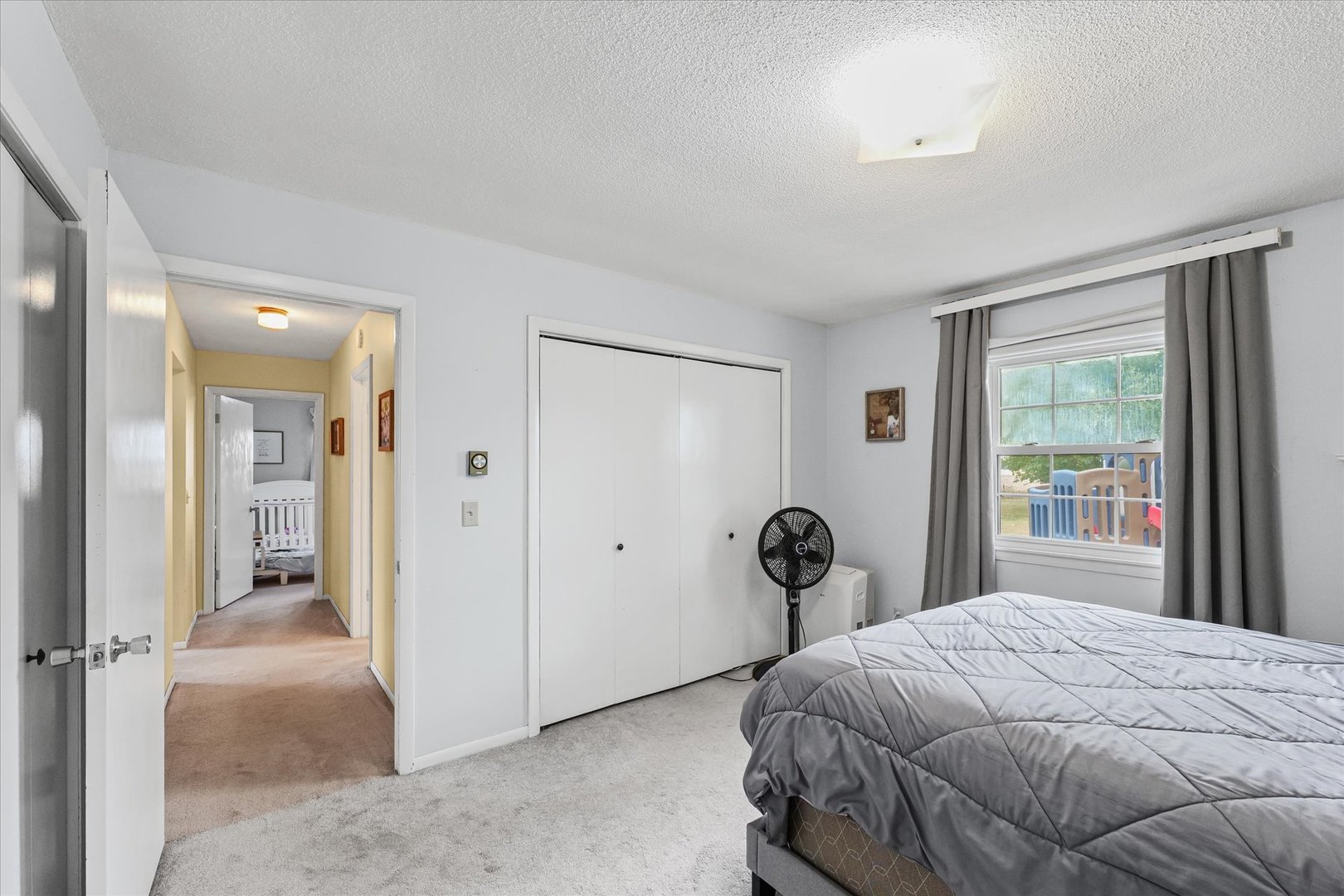 407 Church Street Royal, IL 61871 - Photo 19 of 31 a bedroom with a bed and a large window