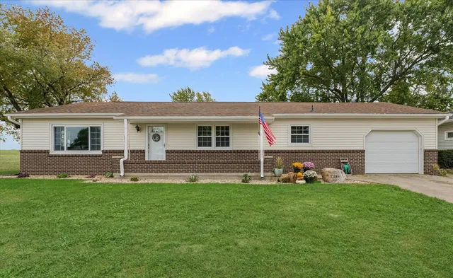 a front view of house with yard with green space