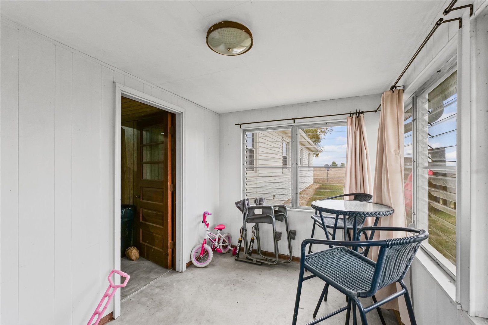 407 Church Street Royal, IL 61871 - Photo 24 of 31 a view of a livingroom with furniture and a window