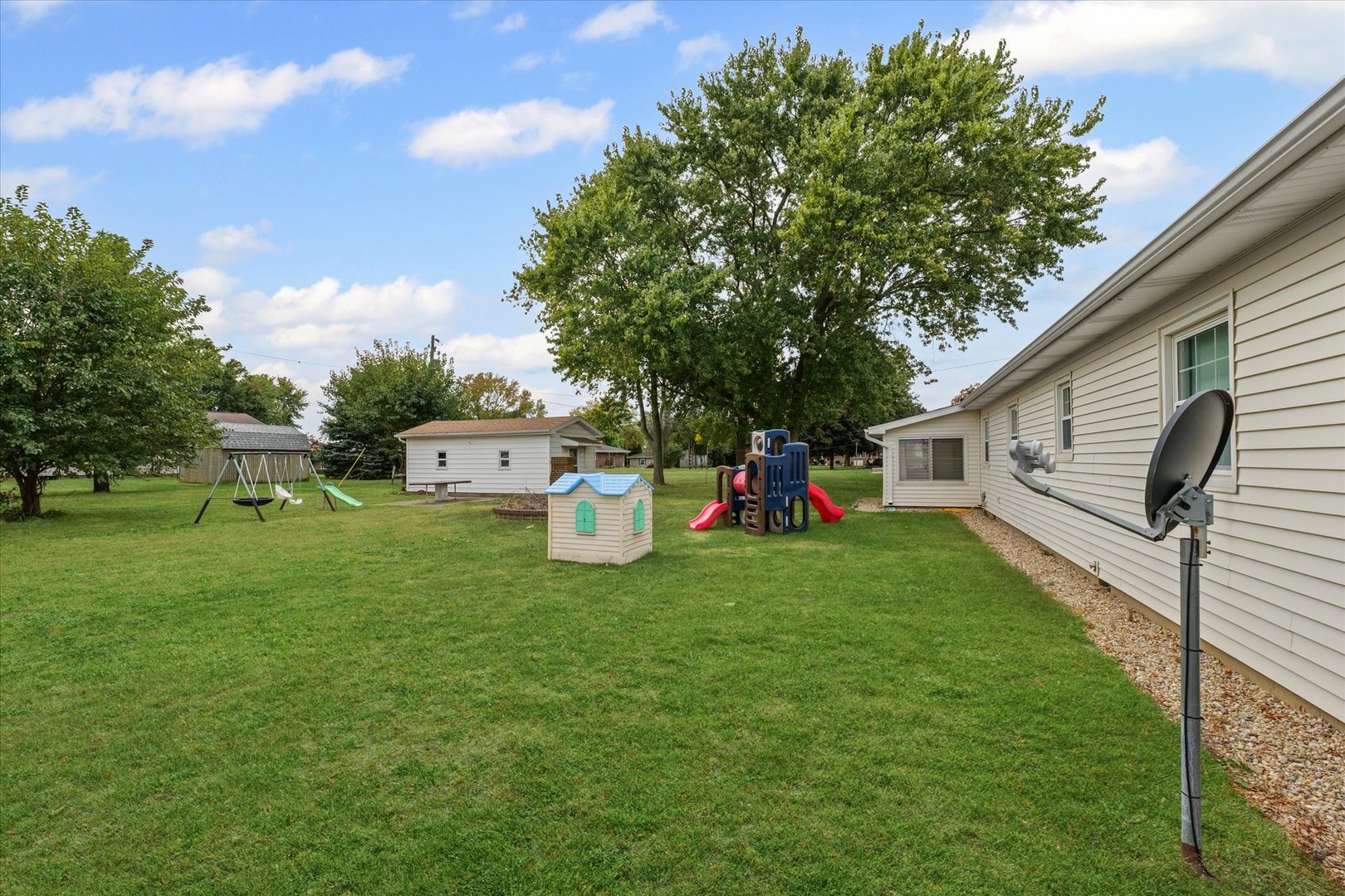 407 Church Street Royal, IL 61871 - Photo 27 of 31 a front view of a house with a yard and trees