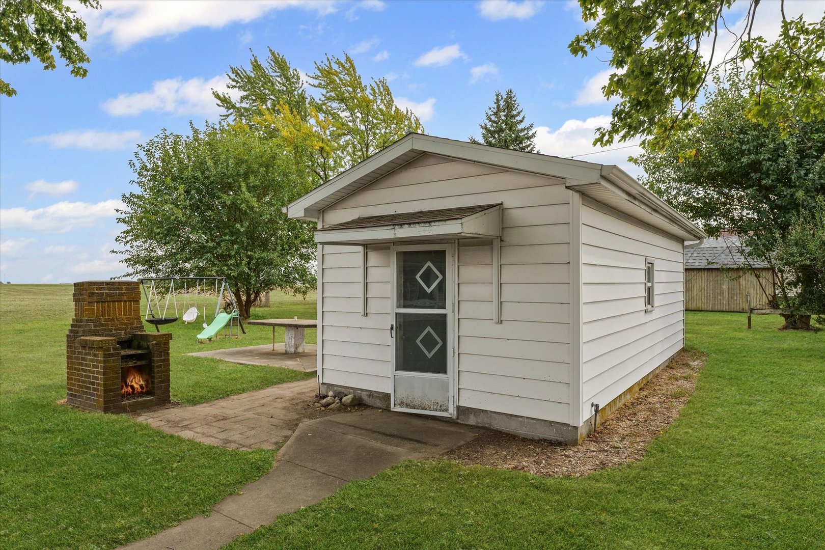 407 Church Street Royal, IL 61871 - Photo 30 of 31 a front view of a house with a garden