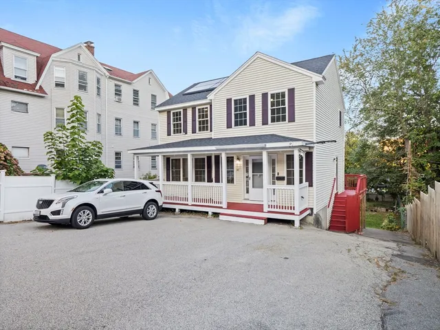 a car parked in front of a house