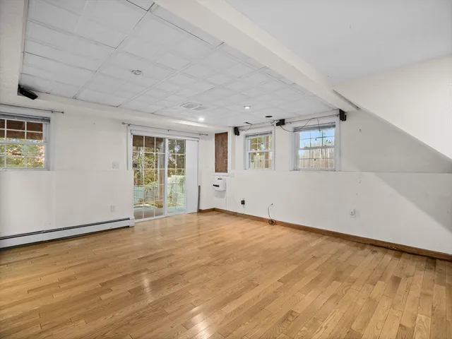 a view of a room with gym equipment and a window