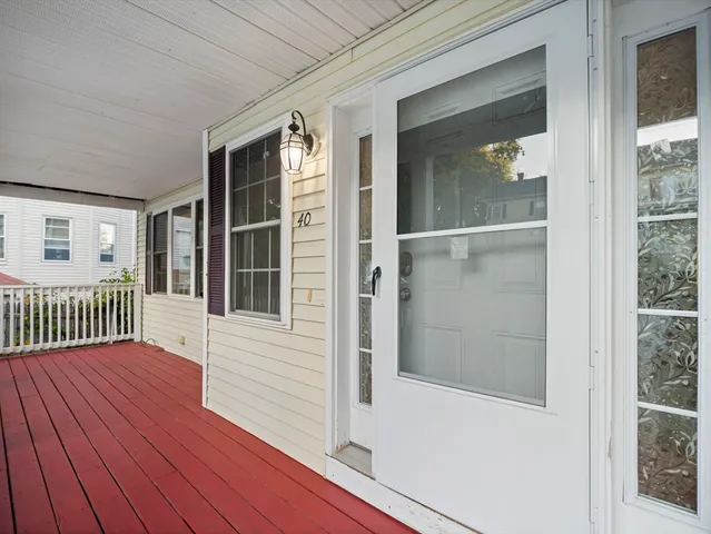 a view of balcony with wooden floor