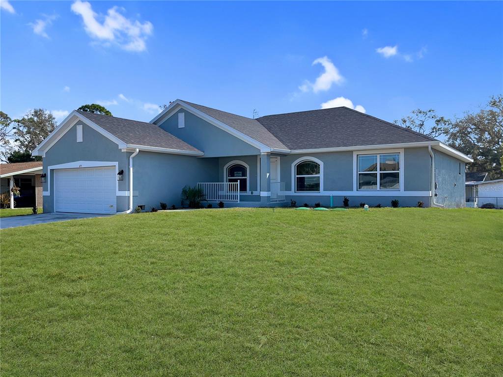 695 Clematis Road Venice, FL 34293 - Photo 1 of 1 a front view of house with a garden